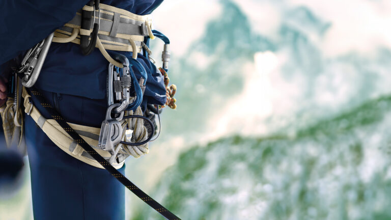 Man with climbing equipment.